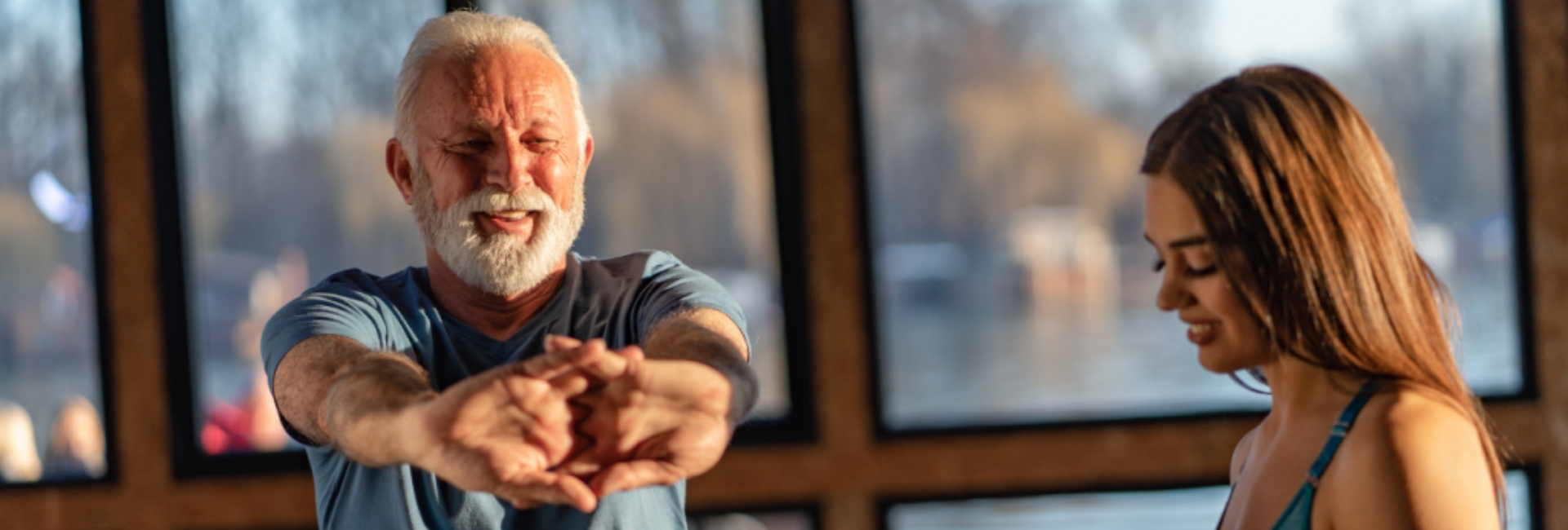 gym-member-gets-assisted-stretch-instruction-at-parkway-athletic-club-in-carson-city-nevada-location
